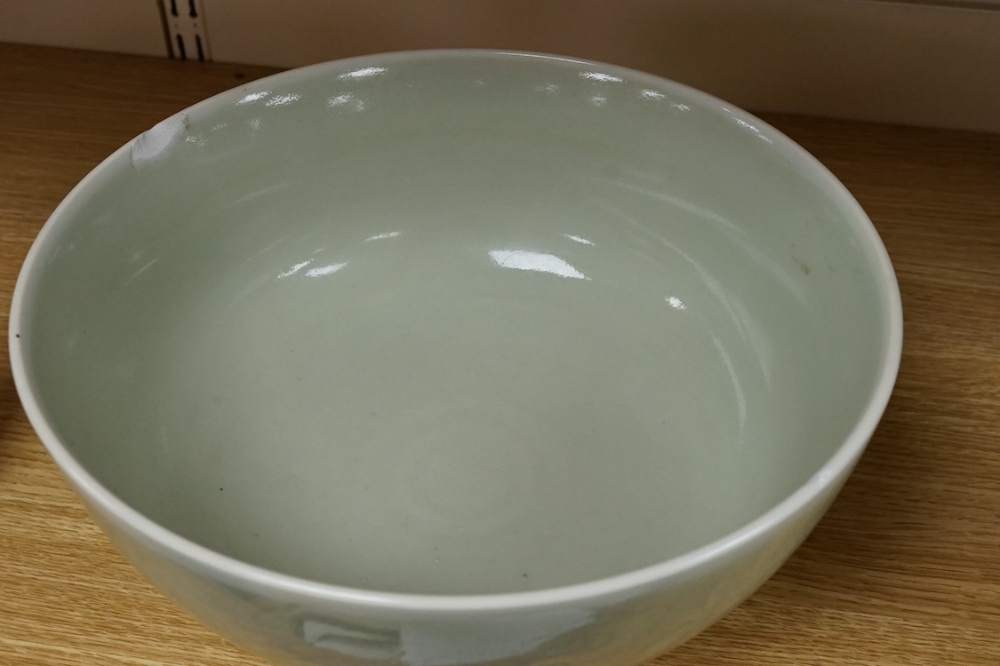 A Chinese celadon glazed ‘Phoenix’ wine ewer, late 19th century/ early 20th century, and a celadon glazed bowl, largest 26cm high
